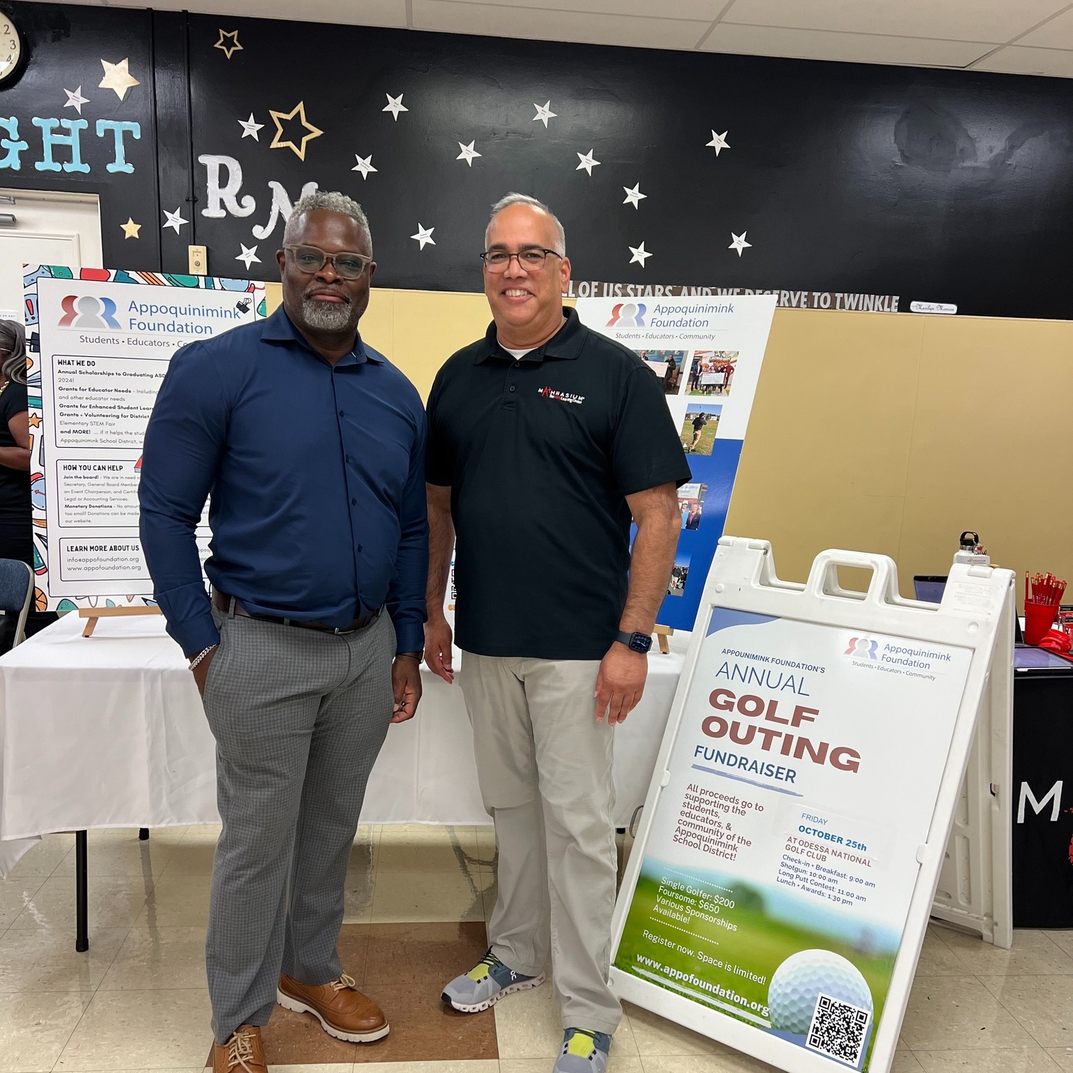 Rich Berry and Amar Tailor of the Appoquinimink Foundation at Redding Middle School's Open House